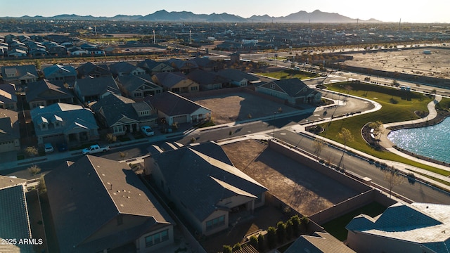 birds eye view of property featuring a water and mountain view