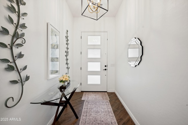 foyer entrance with an inviting chandelier