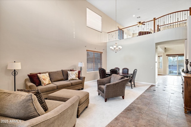 living room featuring a high ceiling and a notable chandelier