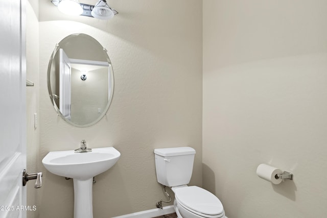 bathroom featuring toilet