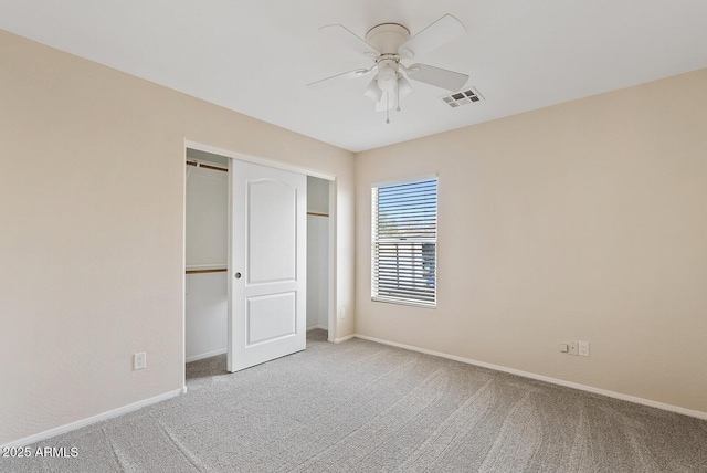 unfurnished bedroom with carpet, ceiling fan, and a closet