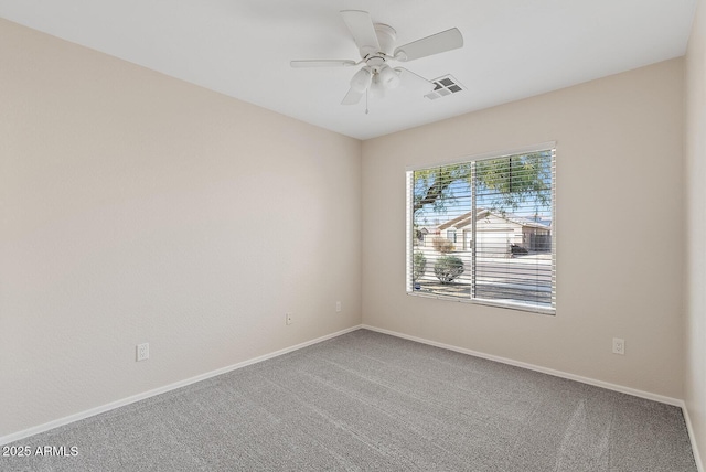 unfurnished room with ceiling fan and carpet floors