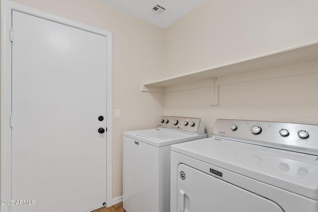 washroom with washing machine and dryer