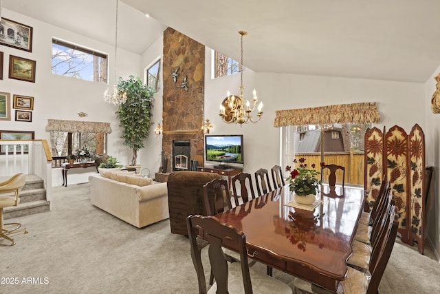 dining area featuring carpet floors, a healthy amount of sunlight, stairs, and a notable chandelier