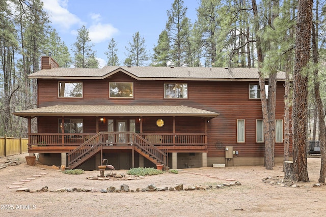 view of front of property with stairway and a chimney