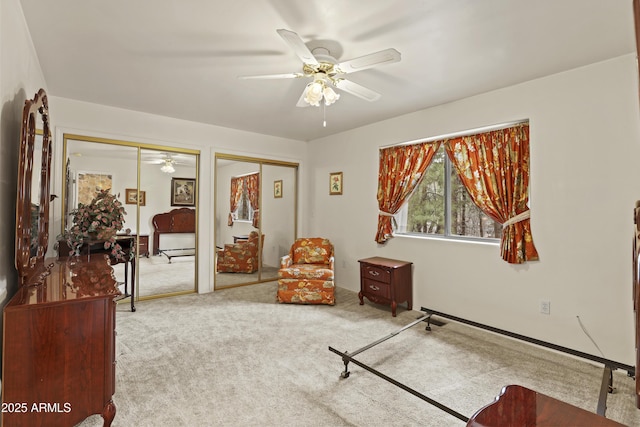 sitting room with carpet floors and ceiling fan