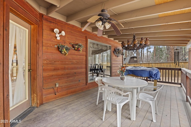 deck with ceiling fan and outdoor dining area