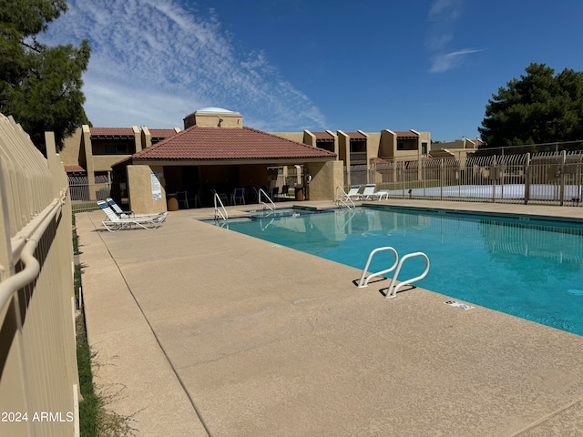 view of swimming pool with a patio area