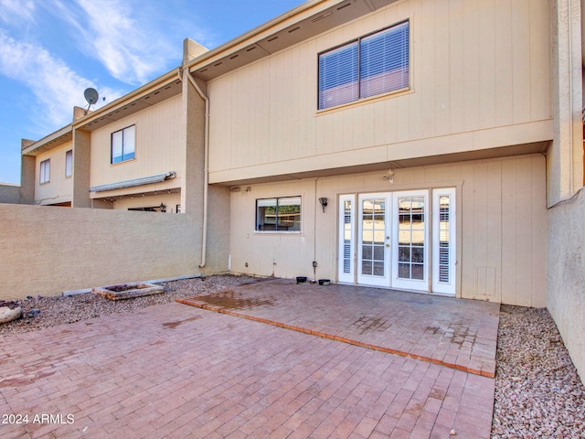 back of property with a patio