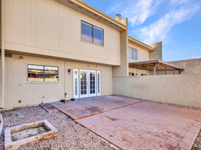 back of property with a patio and ceiling fan