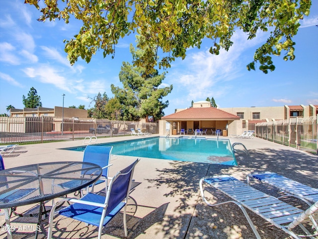 view of swimming pool featuring a patio area