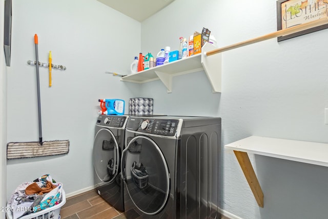 5218 W Lydia Ln, Laveen, AZ 85339 - washroom with baseboards, laundry area, washing machine and clothes dryer, and wood finish floors