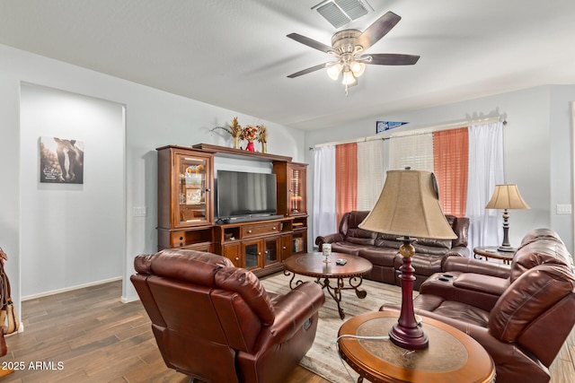 5218 W Lydia Ln, Laveen, AZ 85339 - living room with wood finished floors, baseboards, a ceiling fan, and visible vents