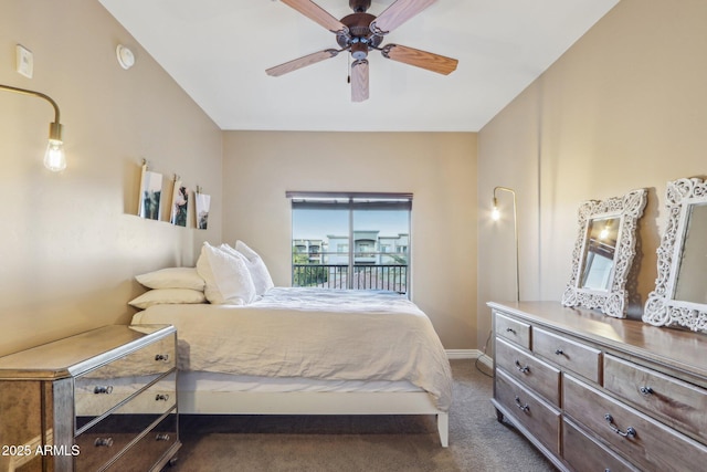 bedroom featuring ceiling fan and dark colored carpet