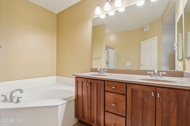 bathroom featuring vanity and plus walk in shower