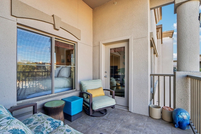 view of patio featuring a balcony