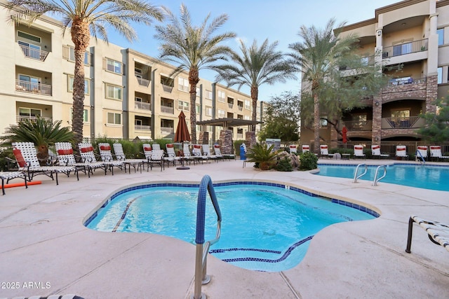 view of swimming pool featuring a patio