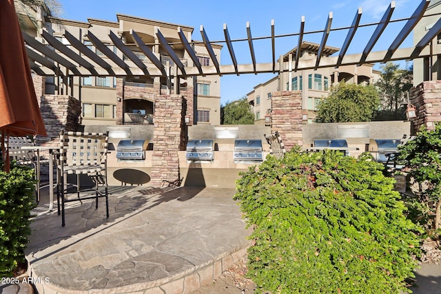 view of patio / terrace featuring area for grilling, grilling area, and a pergola