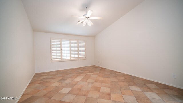 unfurnished room featuring vaulted ceiling and ceiling fan