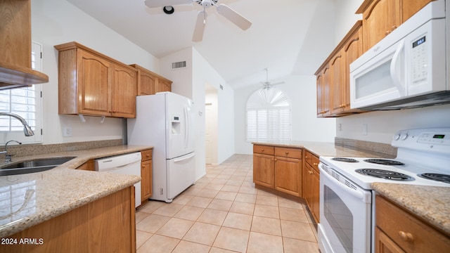 kitchen with white appliances, vaulted ceiling, ceiling fan, and sink