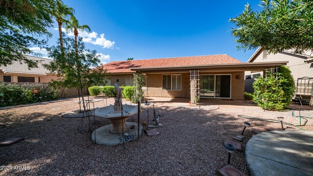 rear view of property featuring a patio