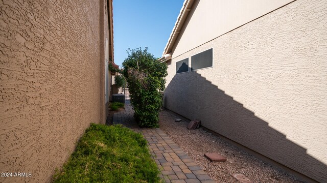 view of side of property featuring central AC