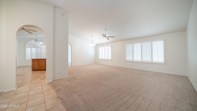 spare room featuring ceiling fan and light tile patterned flooring