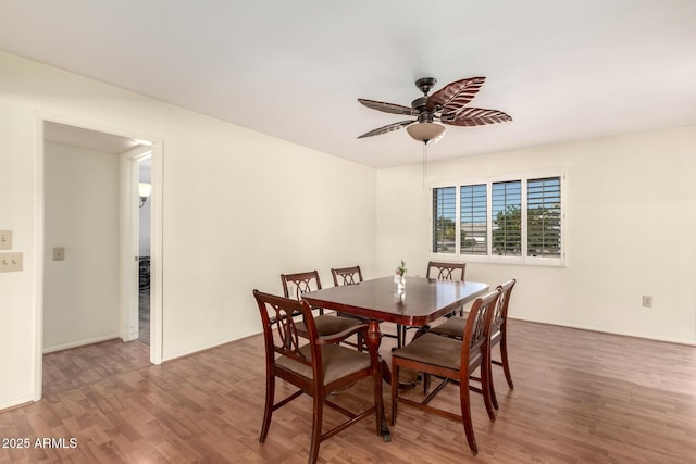 dining area featuring ceiling fan and wood finished floors