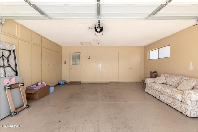garage featuring a garage door opener