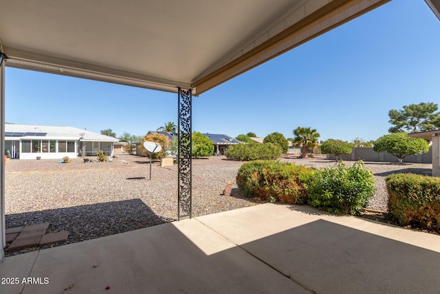 view of patio featuring a sunroom