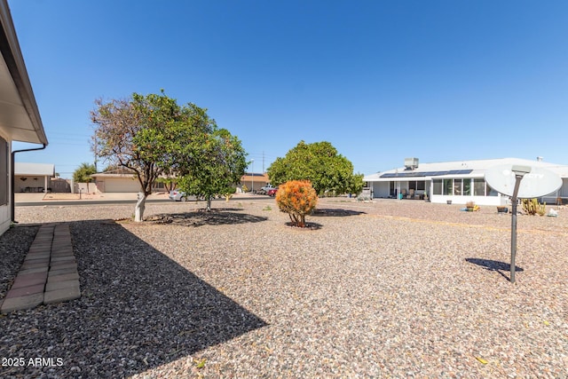 view of yard with a sunroom