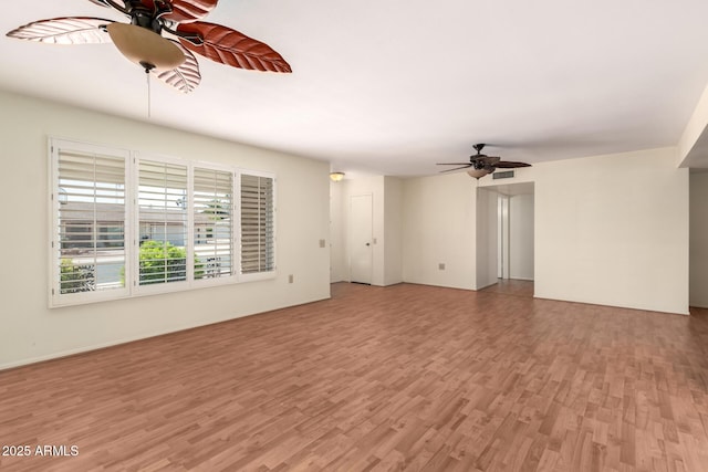 unfurnished living room with light wood-style floors and a ceiling fan