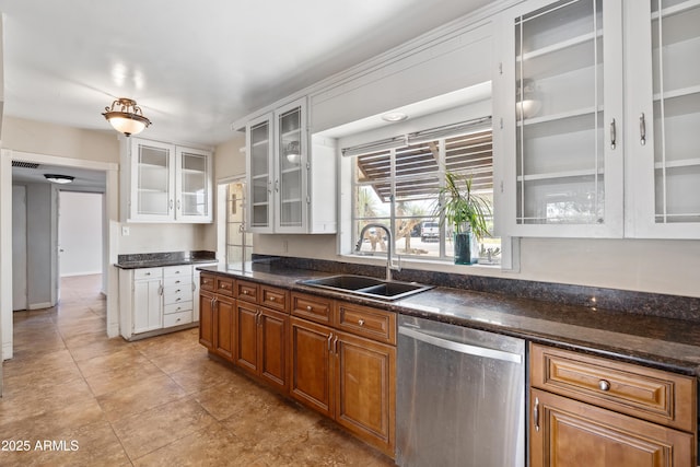 1749 W Monterosa St, Phoenix, AZ 85015 - kitchen with stainless steel dishwasher, white cabinetry, glass insert cabinets, brown cabinetry, and light tile patterned flooring