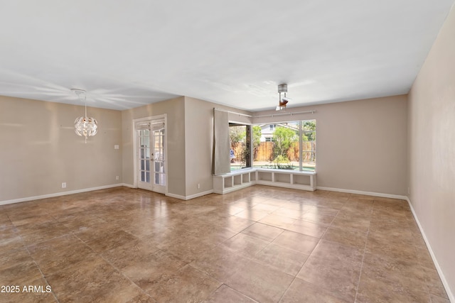 1749 W Monterosa St, Phoenix, AZ 85015 - tiled empty room featuring french doors and a chandelier