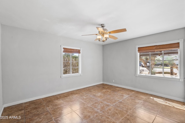 1749 W Monterosa St, Phoenix, AZ 85015 - tiled spare room with ceiling fan and baseboards