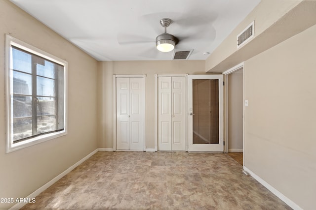 1749 W Monterosa St, Phoenix, AZ 85015 - unfurnished bedroom with two closets and a ceiling fan