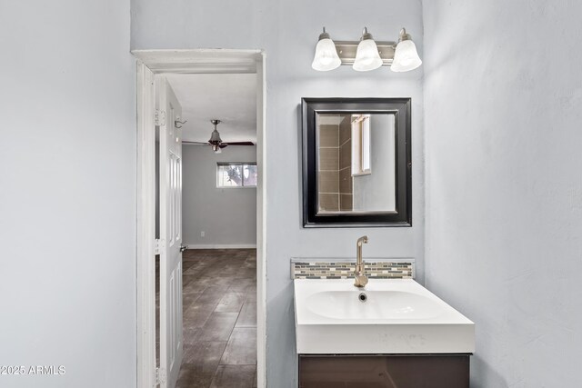 1749 W Monterosa St, Phoenix, AZ 85015 - bathroom featuring vanity, a ceiling fan, and decorative backsplash