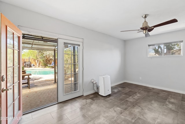 1749 W Monterosa St, Phoenix, AZ 85015 - empty room featuring healthy amount of natural light, ceiling fan, and french doors