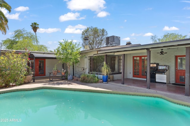 1749 W Monterosa St, Phoenix, AZ 85015 - swimming pool with french doors and a patio area