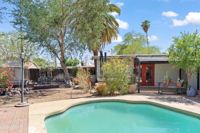 1749 W Monterosa St, Phoenix, AZ 85015 - view of swimming pool featuring french doors, a patio area, and a fenced backyard
