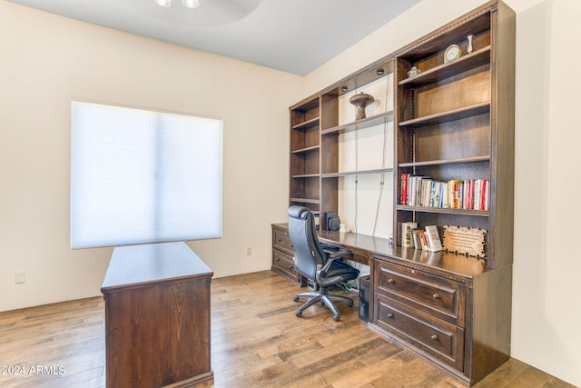 office space with light hardwood / wood-style floors