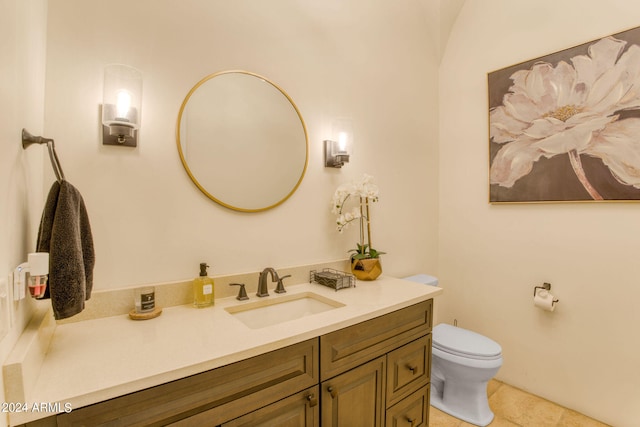 bathroom with vanity, tile patterned flooring, and toilet