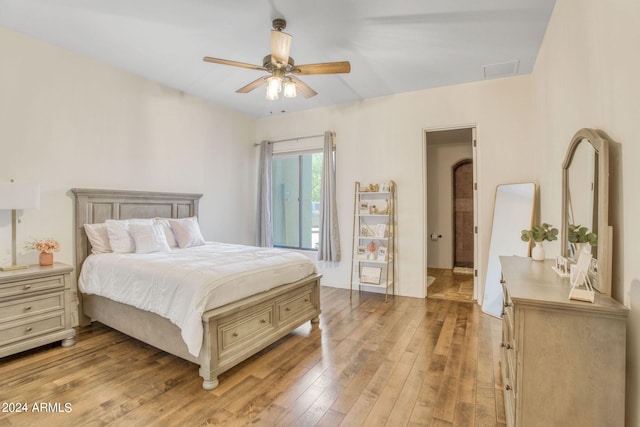 bedroom with light wood-type flooring and ceiling fan