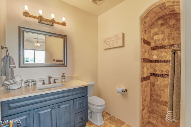 bathroom featuring a shower with curtain, vanity, and toilet