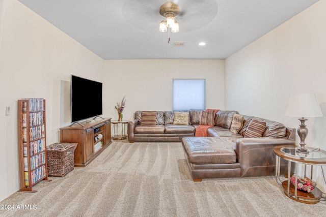 living room featuring ceiling fan and light colored carpet