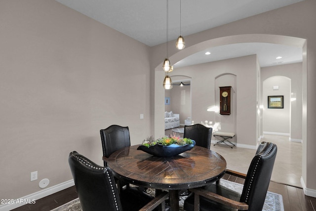 dining room with dark wood-type flooring