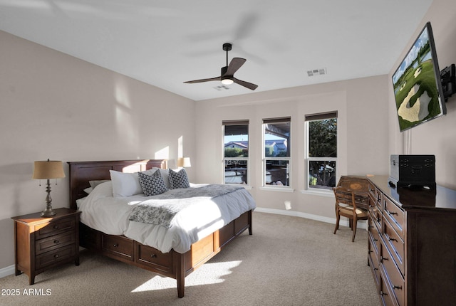 bedroom with ceiling fan and light colored carpet