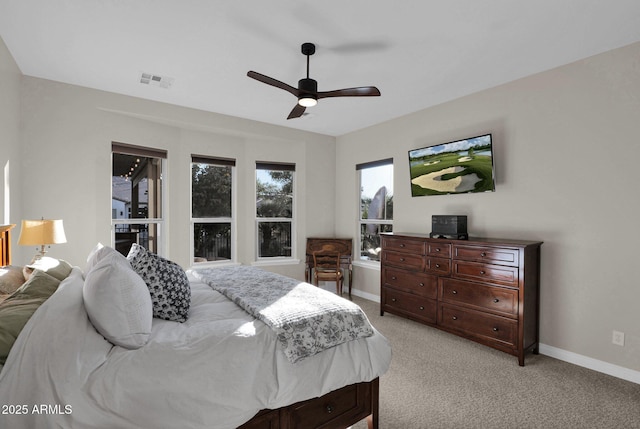 bedroom with ceiling fan and light carpet