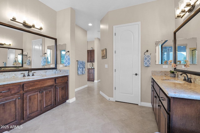 bathroom with tile patterned flooring and vanity