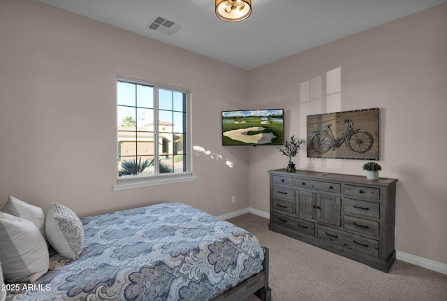 bedroom featuring light carpet